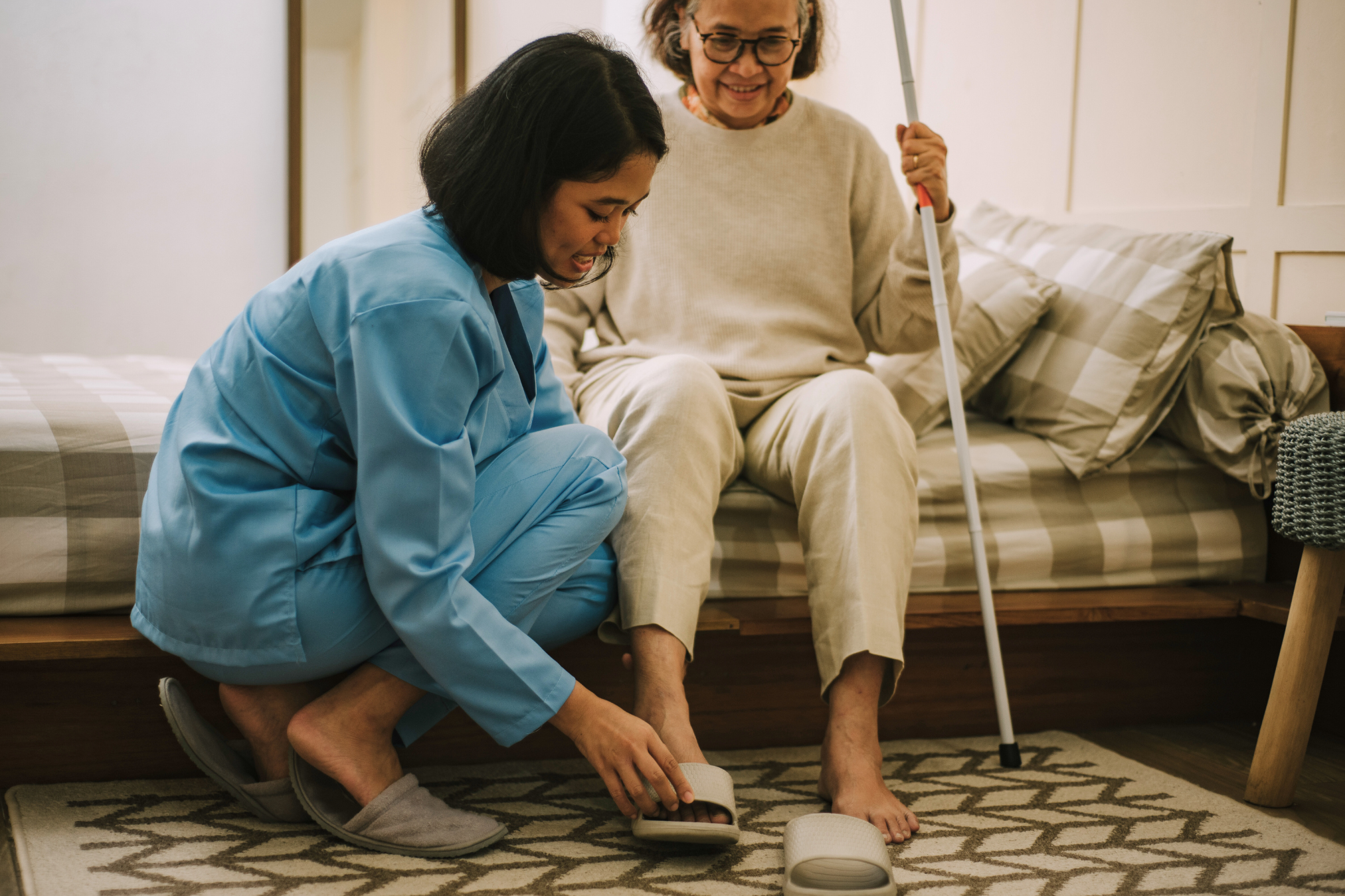 Skilled nurse providing in-home healthcare to a patient